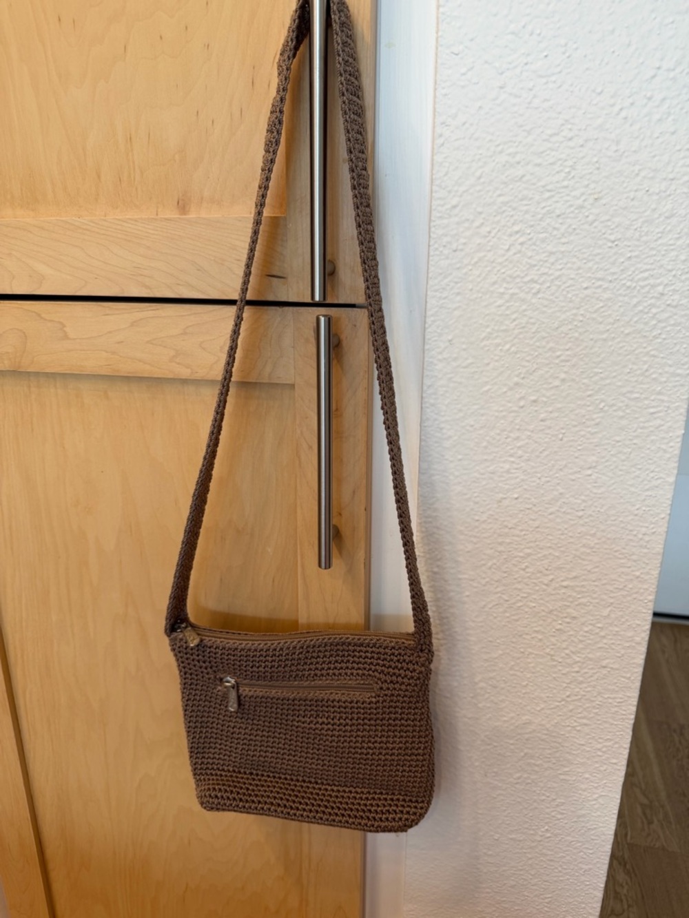 The Sak crochet zip pouch crossbody